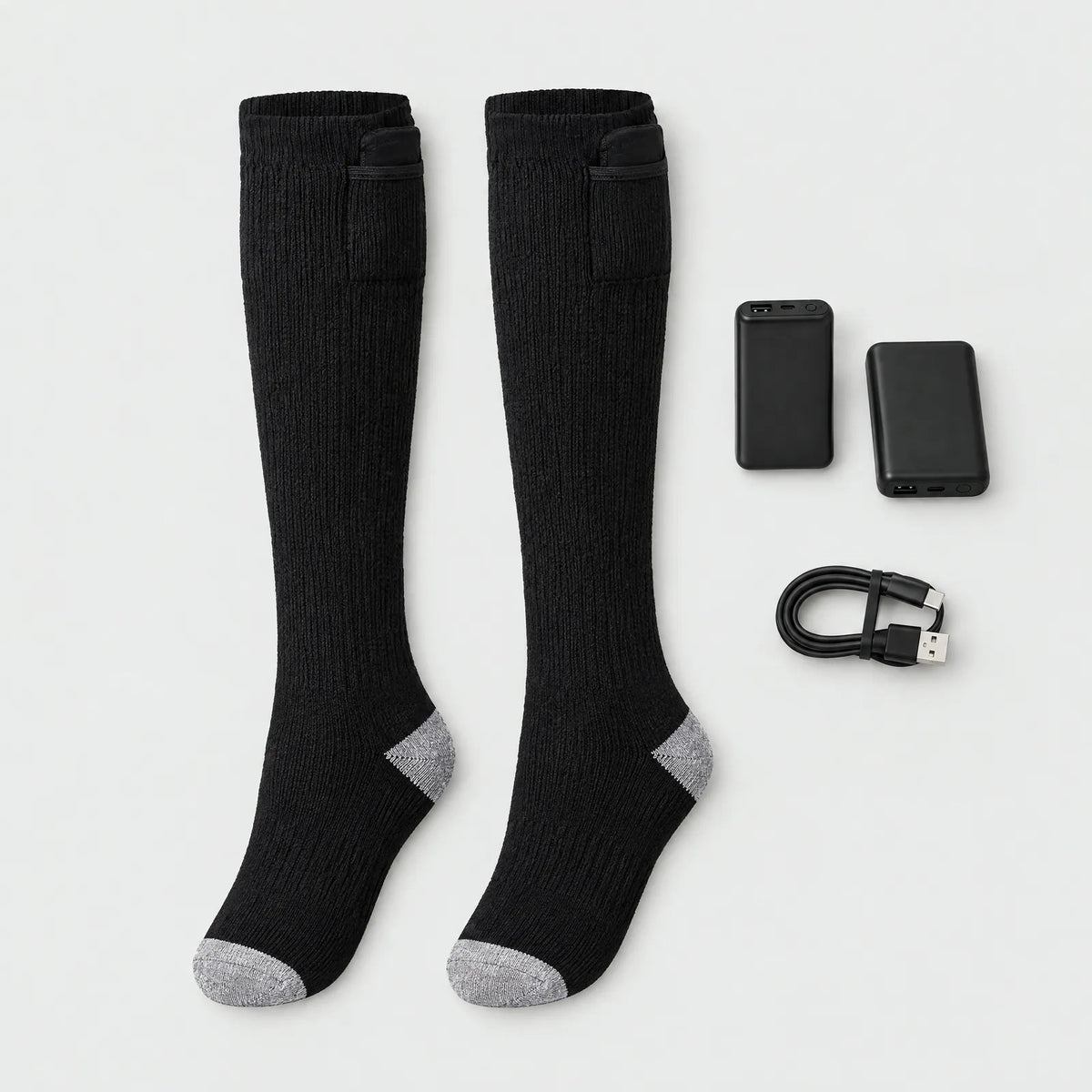 In the box: a pair of heated knee-high socks, two batteries and a USB charging cable