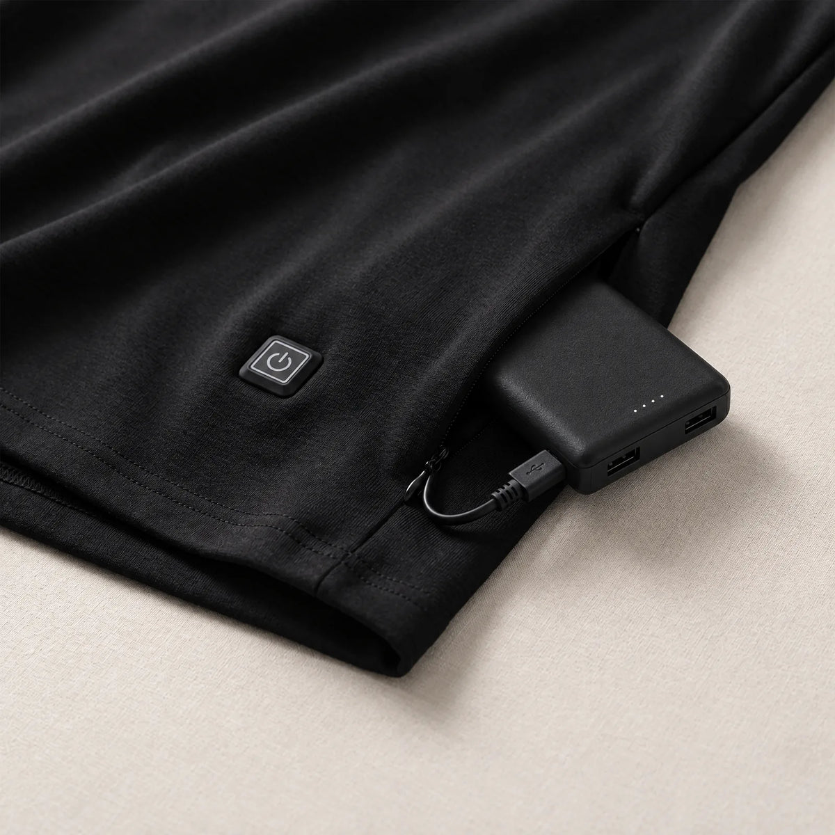 Button at the hem and power bank in the zip pocket